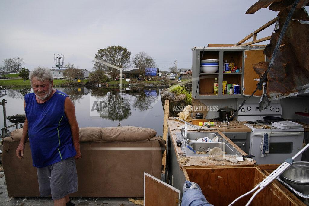 John Locher Philip Adams walks through what remains of his living room and kitchen at his hurricane destroyed home in the aftermath of Hurricane Ida, Monday, Sept. 6, 2021, in Lockport, La. (AP Photo/John Locher)