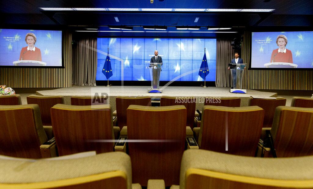 Olivier Matthys European Council President Charles Michel speaks during a media conference after an EU-Western Balkans videoconference summit at the EU Council building in Brussels, Wednesday, May 6, 2020. European Union leaders sought Wednesday to reassure their counterparts from six Balkans countries that the bloc remains the volatile region's most important partner, particularly as the coronavirus hits their societies, ravaging health care systems and economies. (AP Photo/Olivier Matthys, Pool)
