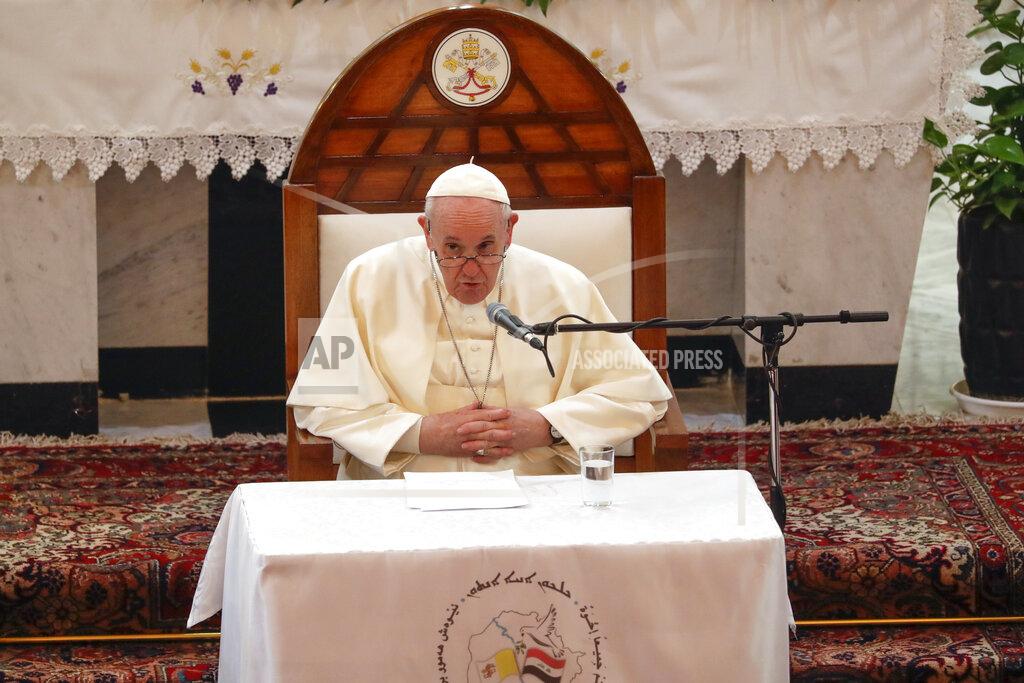 Andrew Medichini Pope Francis delivers his speech during a meeting with bishops and priests, at the Sayidat al-Nejat (Our Lady of Salvation) Cathedral, in Baghdad, Iraq, Friday, March 5, 2021. Pope Francis has arrived in Iraq to urge the country's dwindling number of Christians to stay put and help rebuild the country after years of war and persecution, brushing aside the coronavirus pandemic and security concerns. (AP Photo/Andrew Medichini)