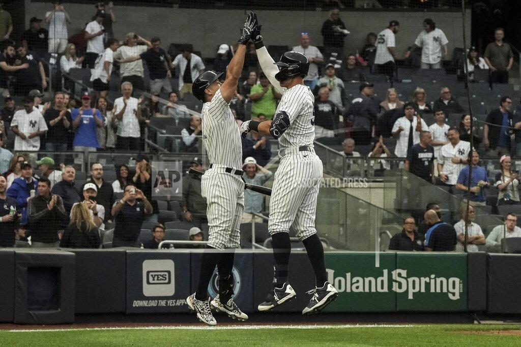 Bebeto Matthews New York Yankees' Aaron Judge, right, high-fives teammate Giancarlo Stanton, left, after hitting a home run in the first inning of a baseball game against the Baltimore Orioles, Monday, May 23, 2022, in New York. (AP Photo/Bebeto Matthews)