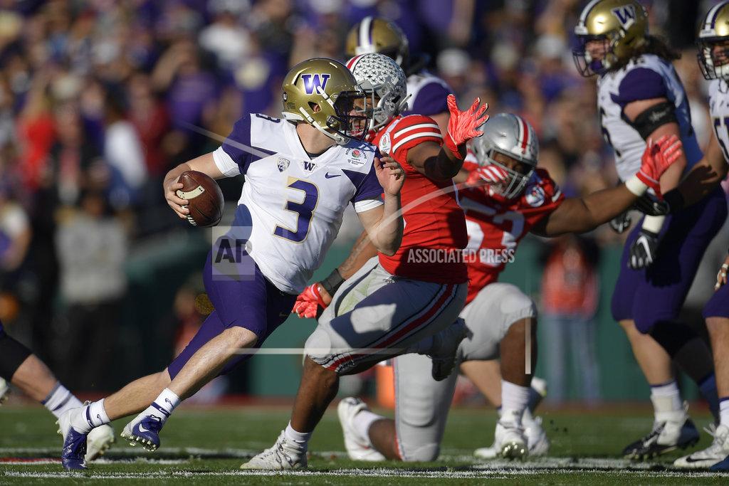 Mark J. Terrill Washington quarterback Jake Browning runs against Ohio State during the first half of the Rose Bowl NCAA college football game Tuesday, Jan. 1, 2019, in Pasadena, Calif. (AP Photo/Mark J. Terrill)