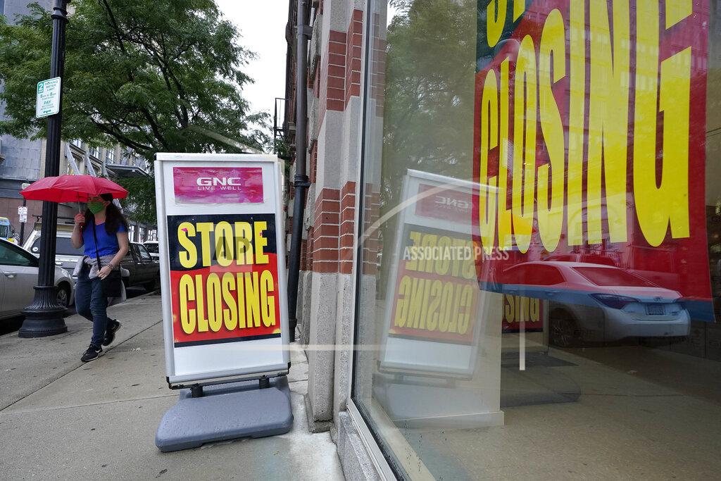 Steven Senne A passer-by walks past a business storefront with store closing signs, Wednesday, Sept. 2, 2020, in Boston. The Congressional Budget Office has warned that the government this year will run the largest budget deficit, as a share of the economy, since 1945, the year World War II ended. Next year, the federal debt — made up of the year-after-year gush of annual deficits — is forecast to exceed the size of the entire American economy for the first time since 1946. (AP Photo/Steven Senne)