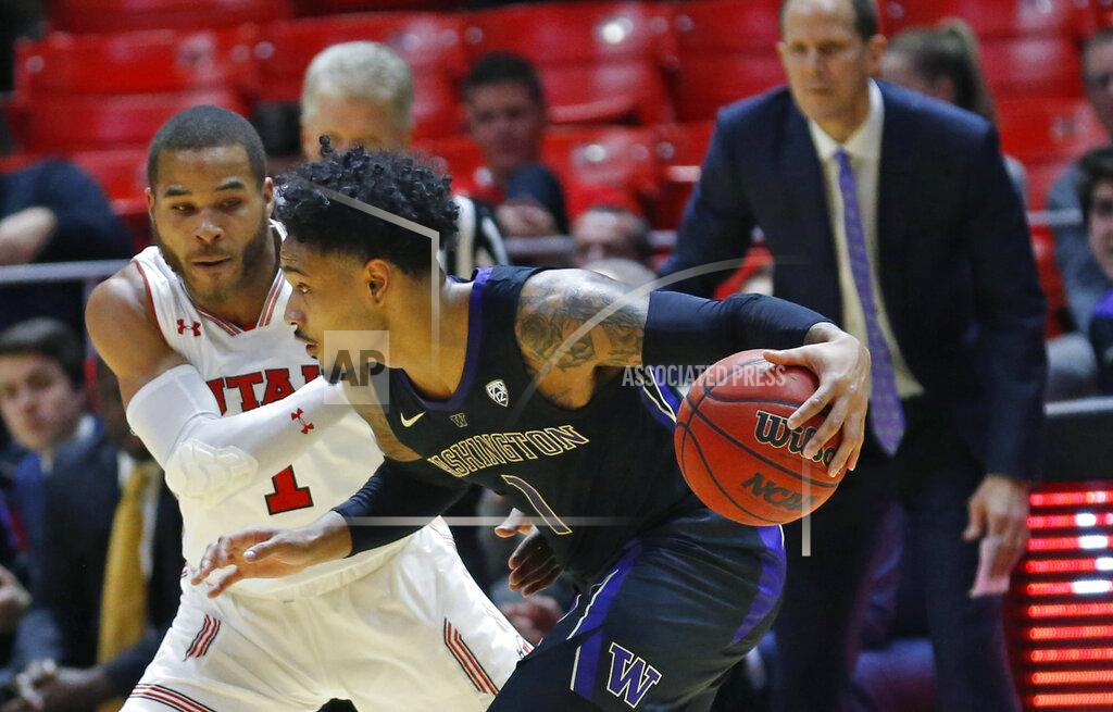 Rick Bowmer Washington guard David Crisp (1) drives around Utah guard Charles Jones Jr (1) during the second half of an NCAA college basketball game Thursday, Jan. 10, 2019, in Salt Lake City. (AP Photo/Rick Bowmer)