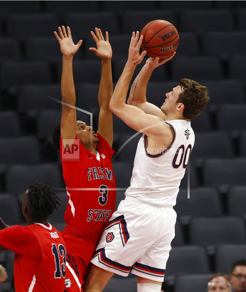 Rich Pedroncelli St. Mary's guard Tanner Krebs, right, shoots over Fresno State guard Jarred Hyder during the second half of an NCAA college basketball game in Sacramento, Calif., Wednesday, Nov. 20, 2019. Saint Mary's won 68-58. (AP Photo/Rich Pedroncelli)
