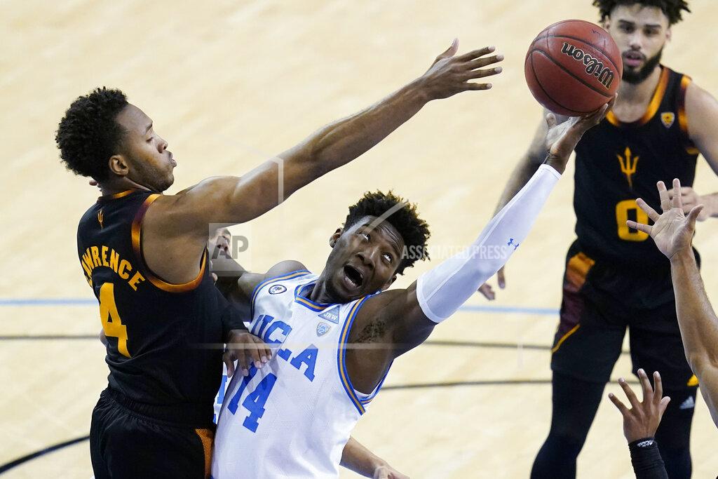 Ashley Landis Arizona State forward Kimani Lawrence (4) and UCLA forward Kenneth Nwuba (14) reach for a rebound during the second half of an NCAA college basketball game Saturday, Feb. 20, 2021, in Los Angeles. (AP Photo/Ashley Landis)