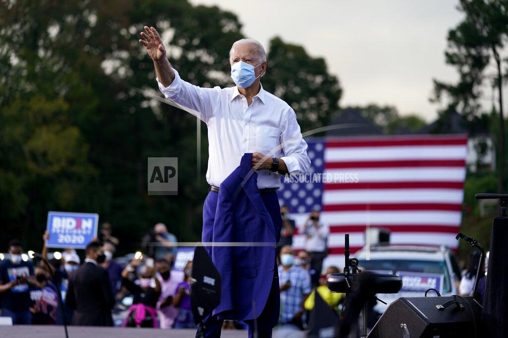 Andrew Harnik Democratic presidential candidate former Vice President Joe Biden greets supporters during a drive-in rally at Cellairis Amphitheatre in Atlanta, Tuesday, Oct. 27, 2020. (AP Photo/Andrew Harnik)