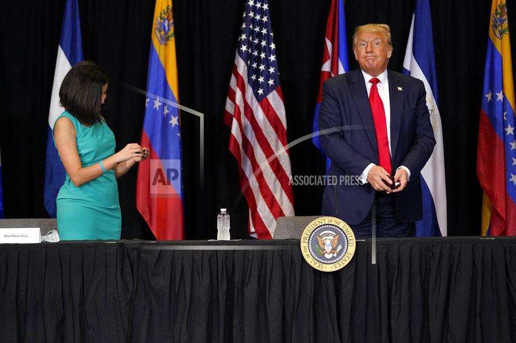 Evan Vucci President Donald Trump and Rosa Maria Paya leave after a roundtable on Venezuela at Iglesia Doral Jesus Worship Center, Friday, July 10, 2020, in Doral, Fla. (AP Photo/Evan Vucci)