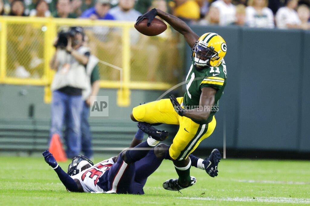 Matt Ludtke Green Bay Packers' Devin Funchess catches a pass with Houston Texans' Keion Crossen defending during the first half of a preseason NFL football game Saturday, Aug. 14, 2021, in Green Bay, Wis. (AP Photo/Matt Ludtke)