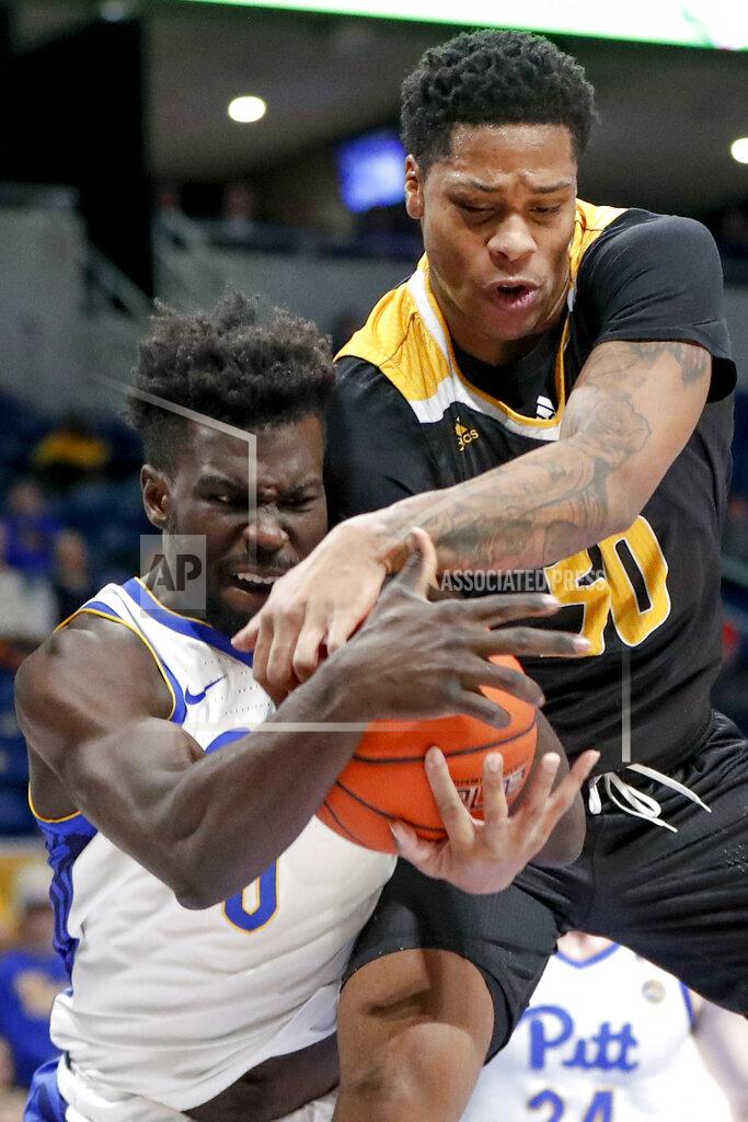 Keith Srakocic Arkansas-Pine Bluff's Chris Smith, right, and Pittsburgh's Eric Hamilton battle for a rebound during the first half of an NCAA college basketball game Thursday, Nov. 21, 2019, in Pittsburgh. (AP Photo/Keith Srakocic)