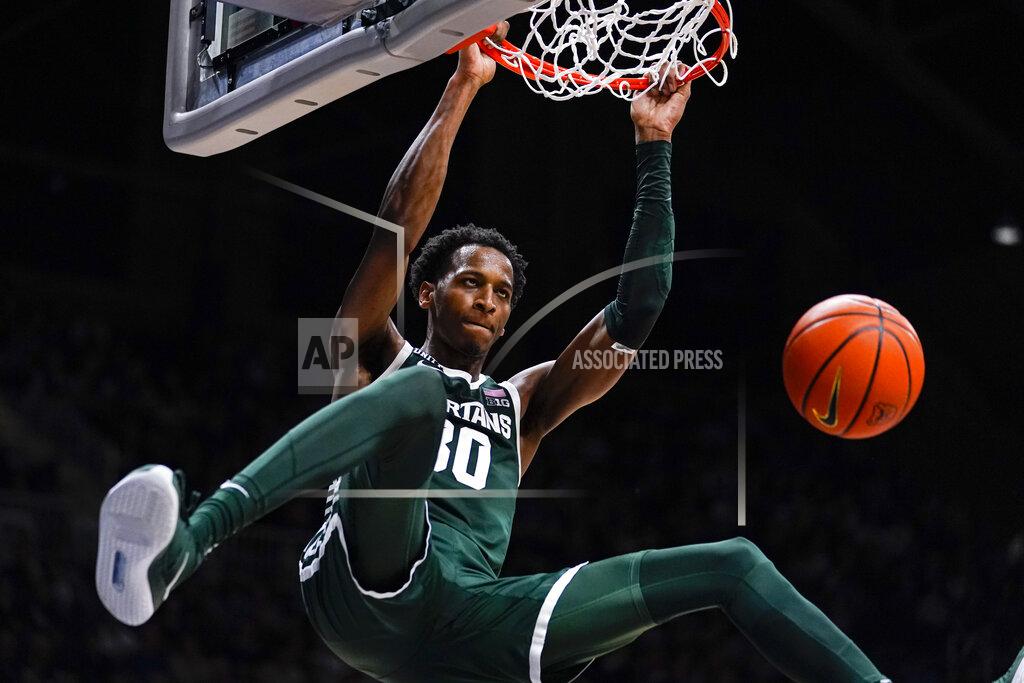 Michael Conroy Michigan State forward Marcus Bingham Jr. (30) gets a dunk against Butler in the second half of an NCAA college basketball game in Indianapolis, Wednesday, Nov. 17, 2021. Michigan State defeated Butler 73-52. (AP Photo/Michael Conroy)