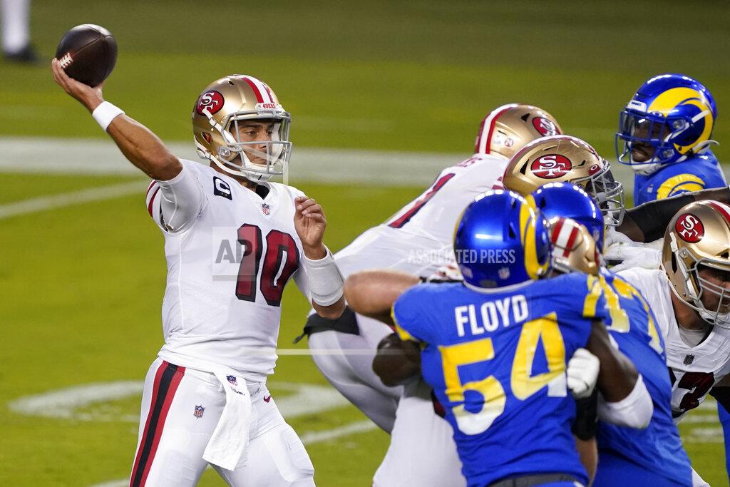 Tony Avelar FILE - In this Oct. 18, 2020, file photo, San Francisco 49ers quarterback Jimmy Garoppolo (10) throws a pass against the Los Angeles Rams during an NFL football game in Santa Clara, Calif. Garoppolo has been hampered by a pair of ankle injuries that have sidelined him for significant time and struggled to match last season's production when he was able to play, raising questions about his future in San Francisco. (AP Photo/Tony Avelar, File)