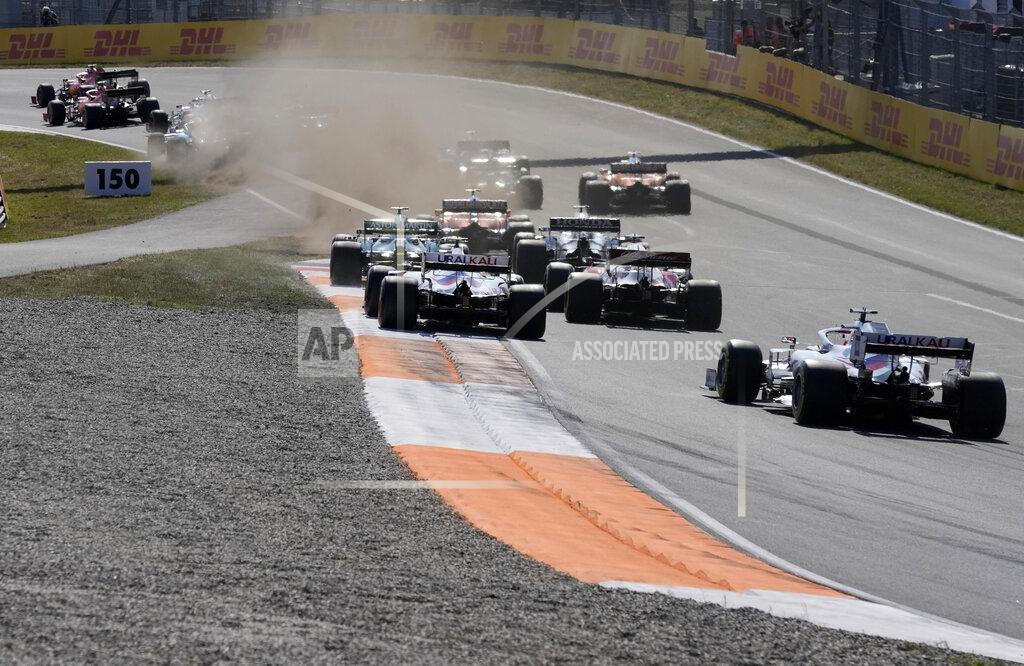 Peter Dejong Red Bull driver Max Verstappen of the Netherlands leads at the start of the Formula One Dutch Grand Prix, at the Zandvoort racetrack, Netherlands, Sunday, Sept. 5, 2021. (AP Photo/Peter Dejong)