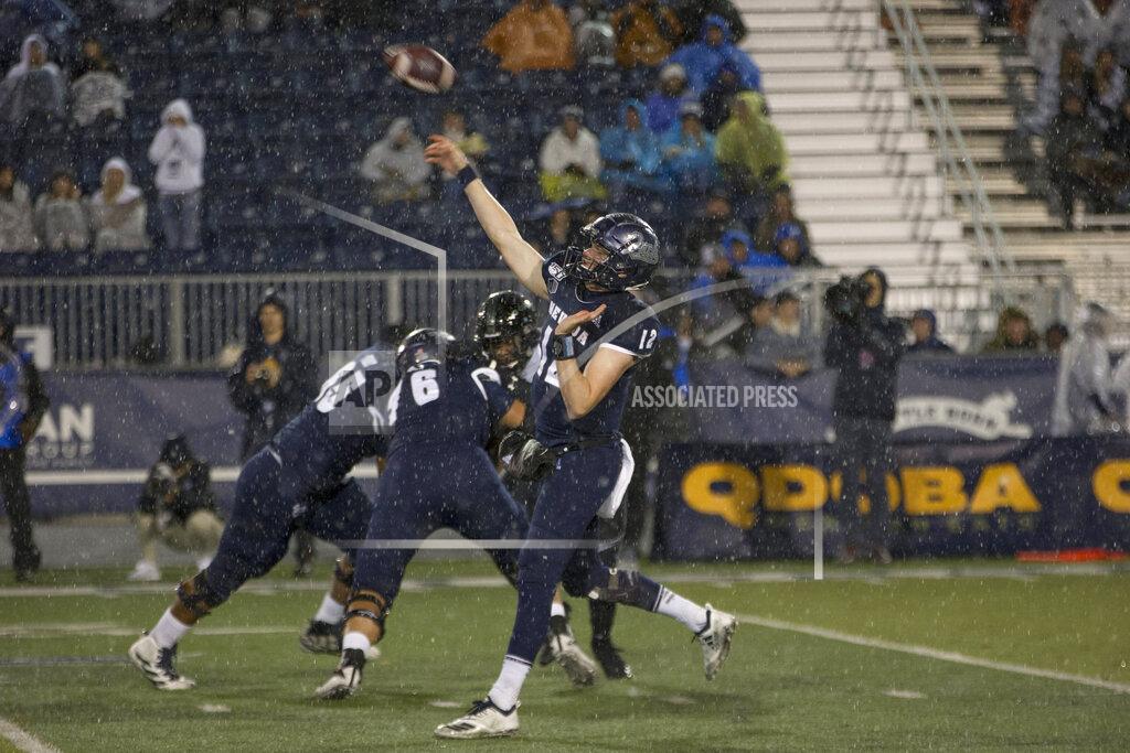 Tom R. Smedes Nevada quarterback Carson Strong (12) passes the ball in the rain against Hawaii in the first half of an NCAA college football game in Reno, Nev., Saturday, Sept. 28, 2019. (AP Photo/Tom R. Smedes)