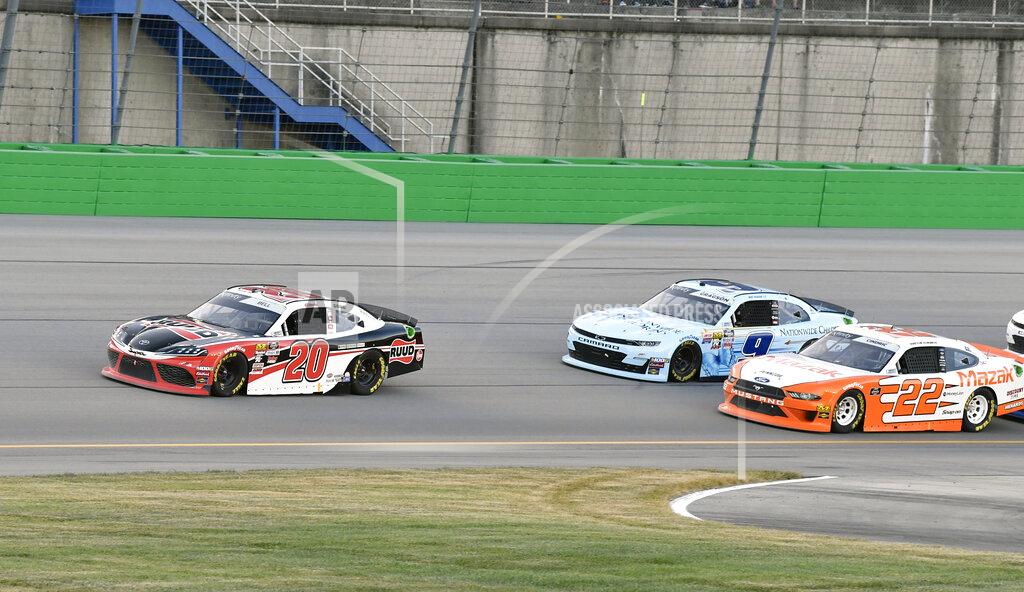 Timothy D. Easley Christopher Bell (20) pulls away from Austin Cindric (22) and Noah Gragson (9) following a restart during the NASCAR Xfinity Series auto race at Kentucky Speedway in Sparta, Ky., Friday, July 12, 2019. (AP Photo/Timothy D. Easley)