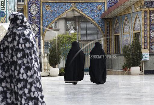 Vahid Salemi Head-to-toe veiled Iranian women walk at the shrine of Saint Saleh in northern Tehran, Iran, Tuesday, April 6, 2021. (AP Photo/Vahid Salemi)