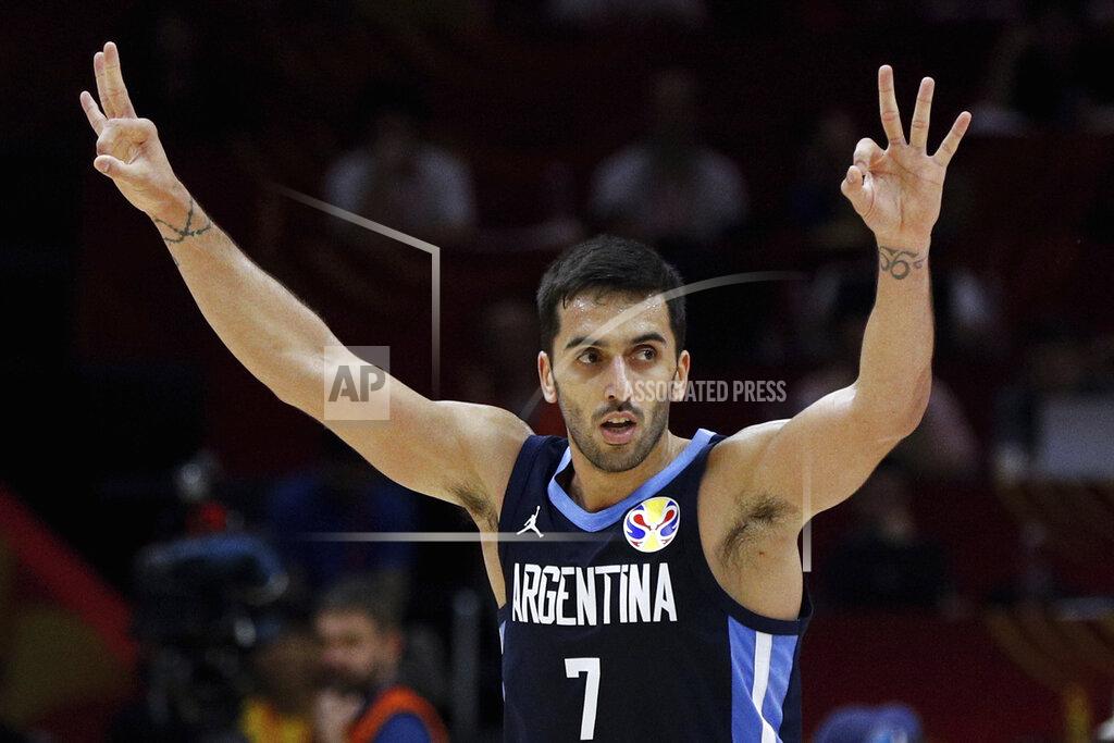 Andy Wong FILE - In this Sept. 4, 2019, file photo, Facundo Campazzo of Argentina celebrates after a teammate's 3-pointer against Russia during their Group B match in the FIBA Basketball World Cup at the Wuhan Sport Center in Wuhan in central China's Hubei province. Campazzo agreed to a two-year deal with the Denver Nuggets on Friday, Nov. 20, 2020, the opening day of free agency, according to a person with direct knowledge of the deal. The person spoke to The Associated Press on condition of anonymity because the contract remains unfinished until at least Sunday, when the NBA moratorium on new signings will be lifted. (AP Photo/Andy Wong, File)