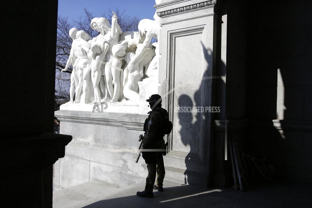 Jacqueline Larma A Capitol police officer stands at the front entrance of the Pennsylvania Capitol building Tuesday Jan. 12, 2021, in Harrisburg, Pa. State capitols across the country are under heightened security after the siege of the U.S. Capitol last week. (AP Photo/Jacqueline Larma)