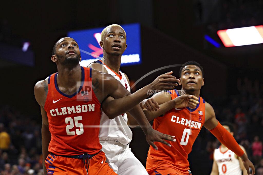 Erin Edgerton Clemson forward Aamir Simms, (25) Virginia forward Mamadi Diakite (25) and Clemson guard Clyde Trapp (0) wait for a rebound during an NCAA college basketball game Wednesday, Feb. 5, 2020, in Charlottesville, Va. (Erin Edgerton/The Daily Progress via AP)