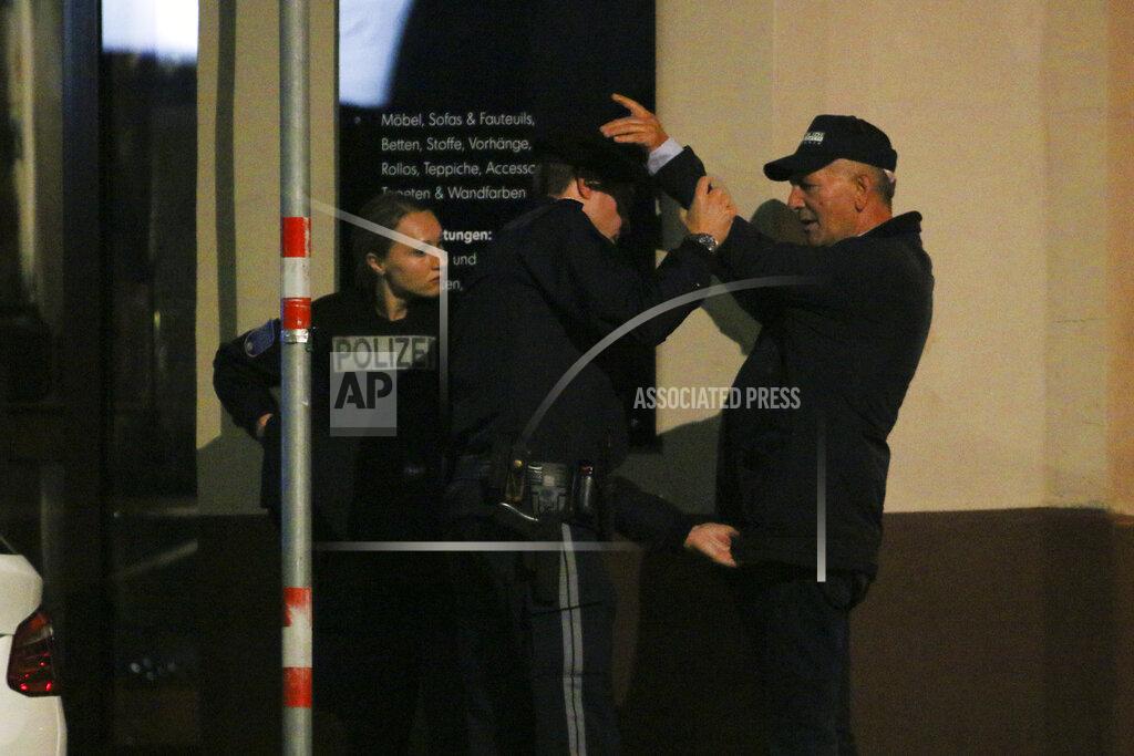 Ronald Zak Police officers check a person following a gunfire in the neighborhood of a synagogue in Vienna, Germany, Monday, Nov. 2, 2020. (Photo/Ronald Zak)