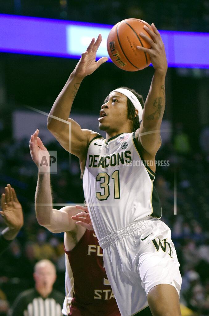 Walt Unks Wake Forest's Alondes Williams drives the lane for a basket in the first half of an NCAA college basketball game against Florida State, Tuesday, Jan. 4, 2022 at Joel Coliseum in Winston-Salem, N.C. (Walt Unks/The Winston-Salem Journal via AP)