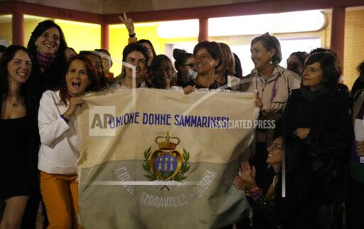Activists of the "Unione Donne Sammarinesi" San Marino's women union camp celebrate in San Marino, Sunday, Sept. 26, 2021, the victory in a referendum to decriminalize abortion in certain circumstances. Women in San Marino seeking an abortion usually go to neighboring Italy. San Marino, one of the world's oldest republics, has a population of about 33,000 and is one of the last European states that still criminalizes abortion. (AP Photo/Antonio Calanni)