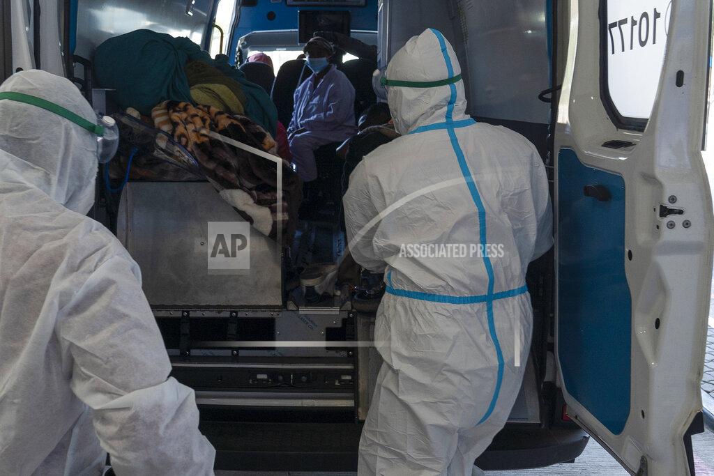 Shiraaz Mohamed Health workers arrive with a patient at the Chris Hani Baragwanath Academic Hospital's COVID-19 facility, in Johannesburg, Monday, June 21, 2021. The head of the World Health Organization, Tedros Adhanom Ghebreyesus, said Monday the U.N. agency is in discussions with numerous companies and institutions to create a technology transfer hub for coronavirus vaccines in South Africa. (AP Photo/Shiraaz Mohamed)