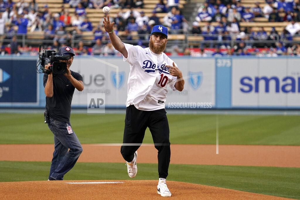 Mark J. Terrill Los Angeles Rams wide receiver Cooper Kupp throws out the ceremonial first pitch prior to a baseball game between the Los Angeles Dodgers and the San Francisco Giants Tuesday, May 3, 2022, in Los Angeles. (AP Photo/Mark J. Terrill)