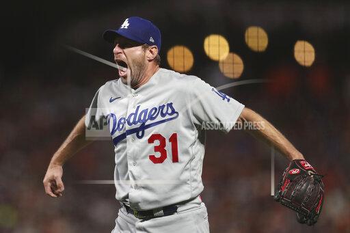 Los Angeles Dodgers pitcher Max Scherzer celebrates after the Dodgers defeated the San Francisco Giants in Game 5 of a baseball National League Division Series Thursday, Oct. 14, 2021, in San Francisco. (AP Photo/Jed Jacobsohn)