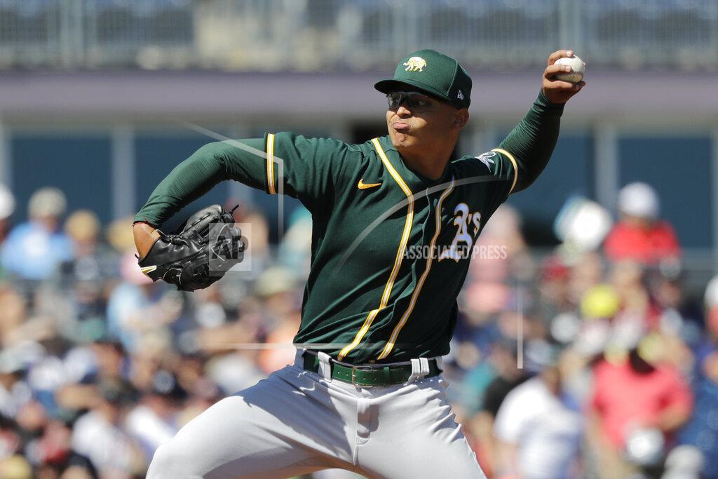 Elaine Thompson Oakland Athletics starting pitcher Jesus Luzardo throws against the Seattle Mariners in the first inning during a spring training baseball game Saturday, March 7, 2020, in Peoria, Ariz. (AP Photo/Elaine Thompson)