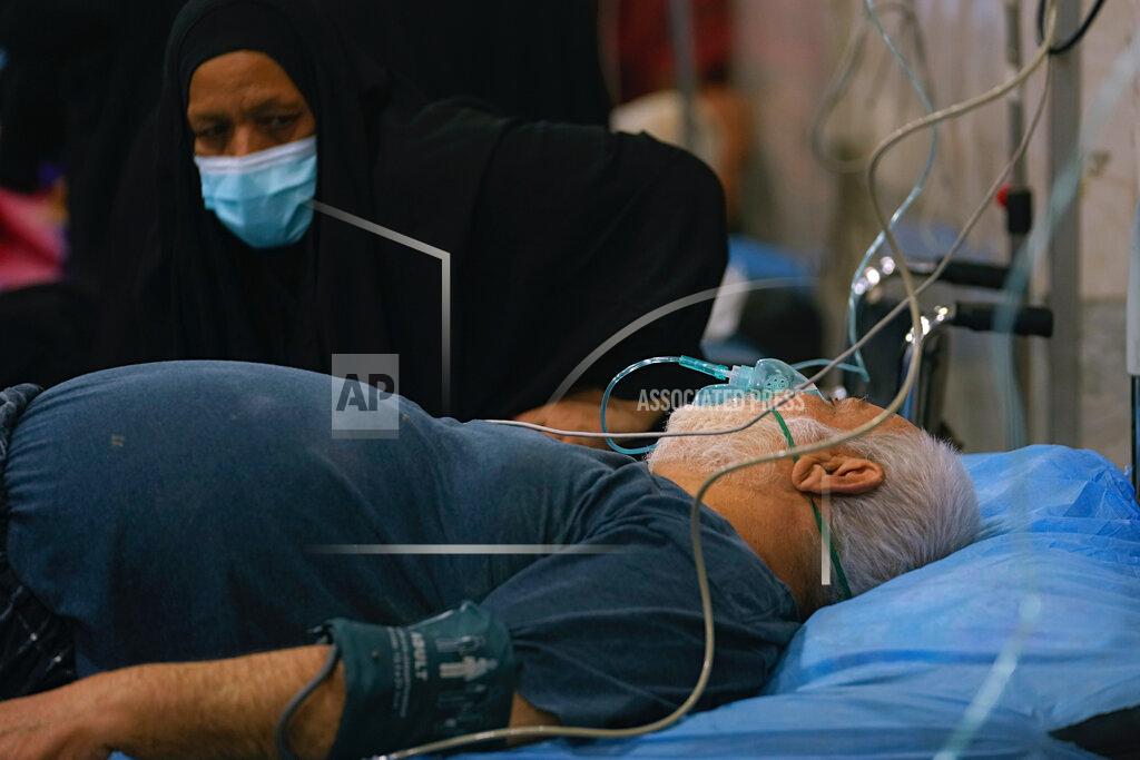 Hadi Mizban People with breathing problems are treated at a hospital during a sandstorm in Baghdad, Iraq, Monday, May 23, 2022. (AP Photo/Hadi Mizban)