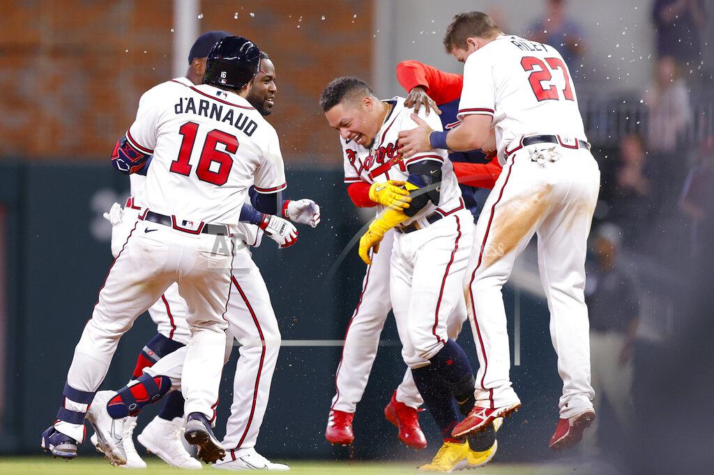 Todd Kirkland Atlanta Braves William Contreras reacts with teammates after his game winning single in the ninth inning of a baseball game against the Philadelphia Phillies, Tuesday, May 24, 2022, in Atlanta. (AP Photo/Todd Kirkland)