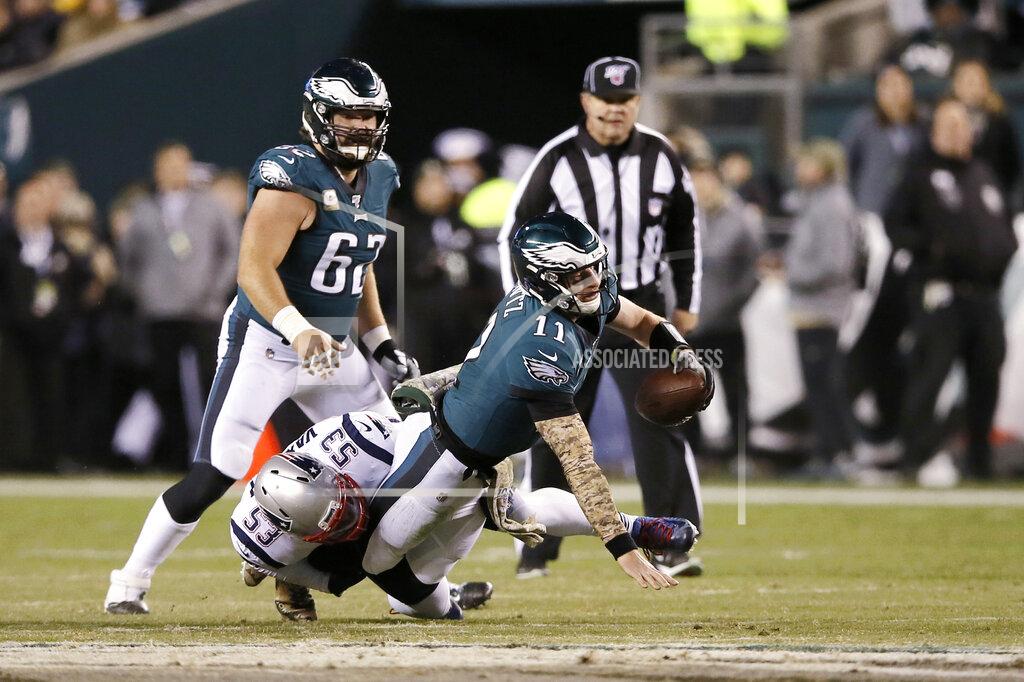 Michael Perez Philadelphia Eagles' Carson Wentz (11) is tackled by New England Patriots' Kyle Van Noy (53) during the first half of an NFL football game, Sunday, Nov. 17, 2019, in Philadelphia. (AP Photo/Michael Perez)