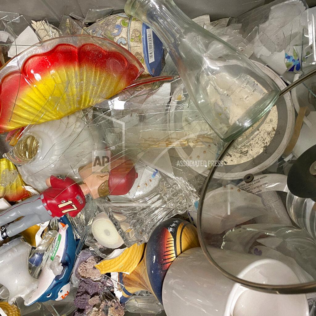 Heather Steeves In this undated photo provided by Goodwill Northern New England is broken glass, and other donations at Goodwill Northern New England, in Westbrook, Maine. Goodwill stores want donors to stop giving them trash. Experts note the coronavirus pandemic has encouraged many to clean their homes and get rid of stuff they don’t want. In the past year, several Goodwill agencies say they've seen an increase in unwanted donations, and in turn, their trash bills. (Heather Steeves/Goodwill Northern New England via AP)