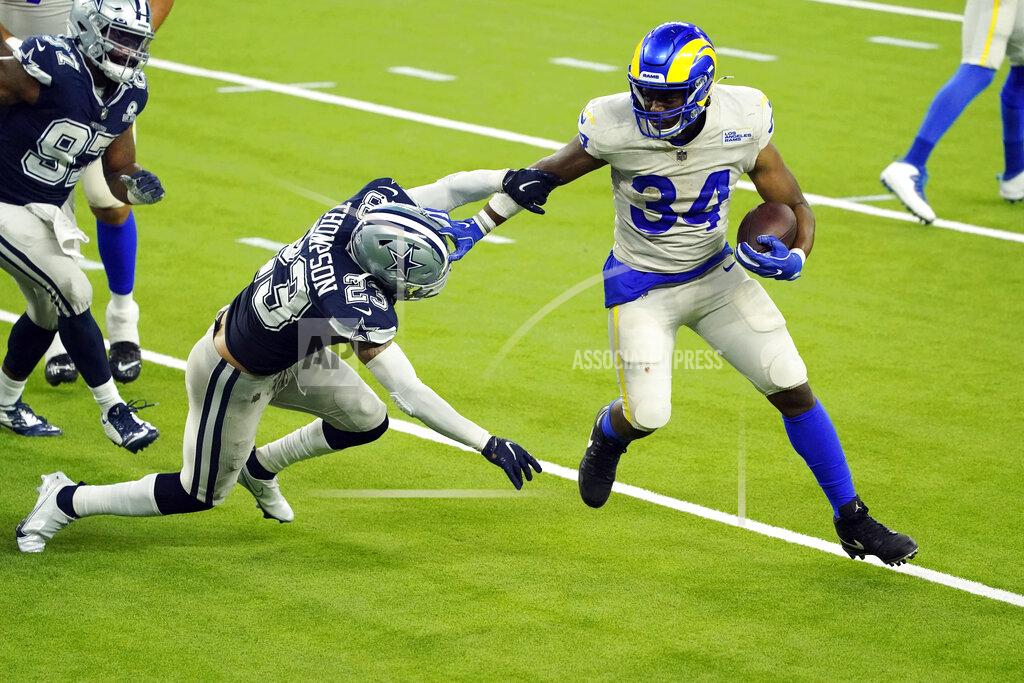 Ashley Landis Los Angeles Rams running back Malcolm Brown (34) runs around Dallas Cowboys safety Darian Thompson (23) to score a touchdown during the second half of an NFL football game Sunday, Sept. 13, 2020, in Inglewood, Calif. (AP Photo/Ashley Landis)