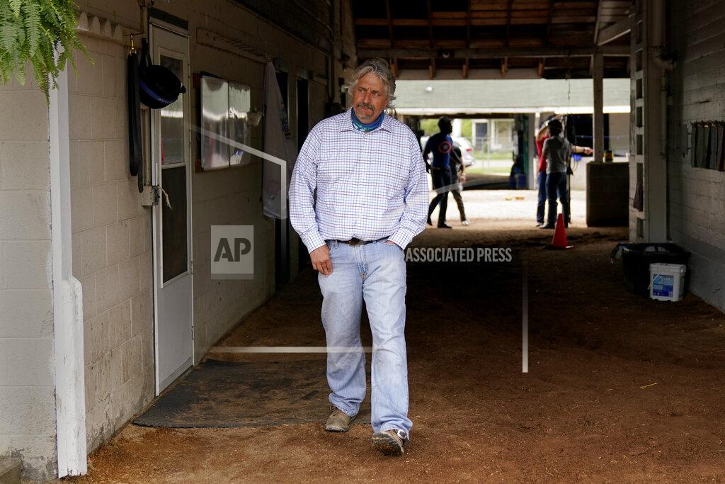 Charlie Riedel Trainer Steve Asmussen looks out from his barn after a workout at Churchill Downs Wednesday, April 28, 2021, in Louisville, Ky. The 147th running of the Kentucky Derby is scheduled for Saturday, May 1. (AP Photo/Charlie Riedel)