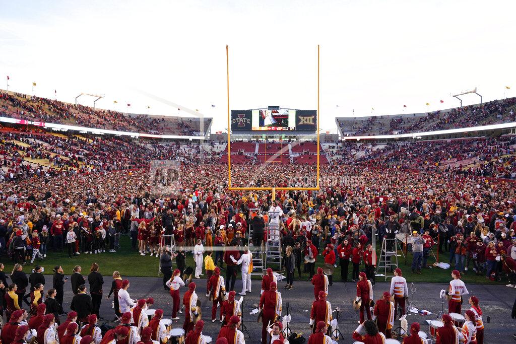 Charlie Neibergall Iowa State fans celebrate on the field after an NCAA college football game against Oklahoma State, Saturday, Oct. 23, 2021, in Ames, Iowa. Iowa State won 24-21. (AP Photo/Charlie Neibergall)