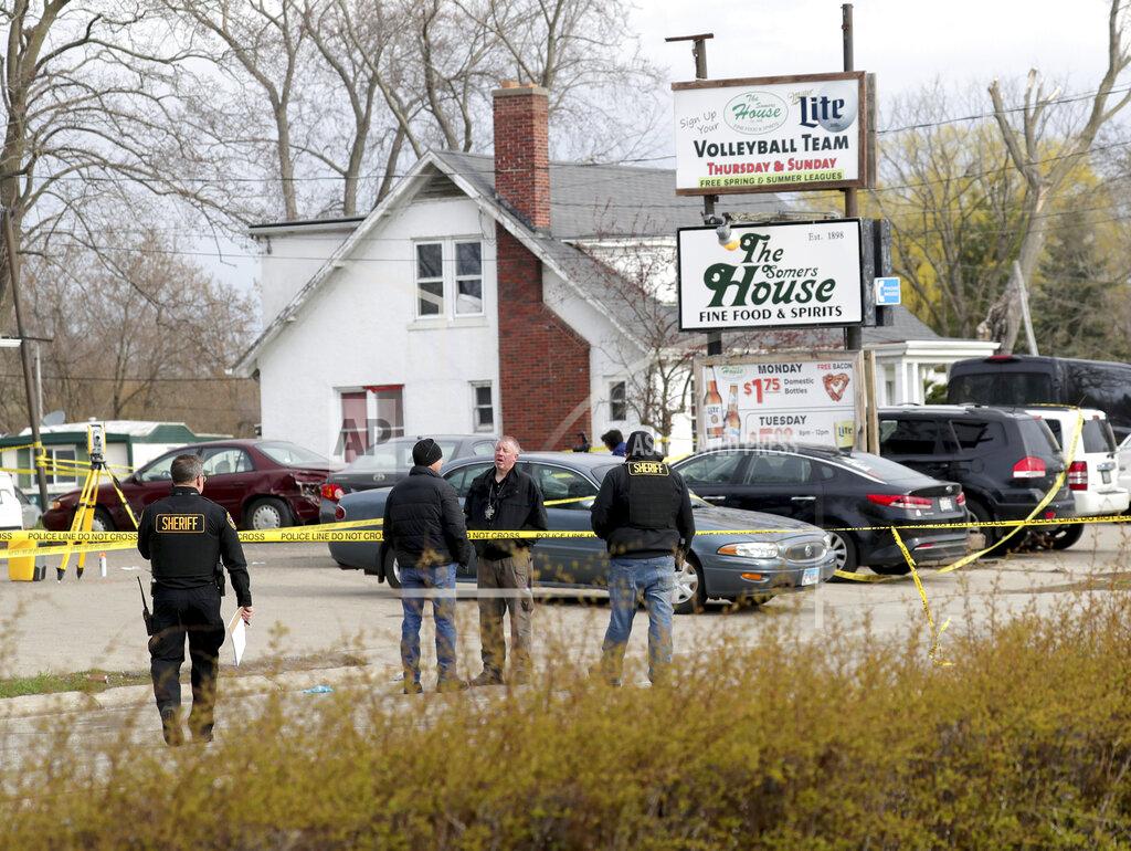 Mike De Sisti Officials investigate the scene of a deadly shooting at Somers House Tavern in Kenosha, Wis., Sunday, April 18, 2021. Several people were killed and two were seriously wounded in a shooting at the busy tavern in southeastern Wisconsin early Sunday, sheriff's officials said. (Mike De Sisti/Milwaukee Journal-Sentinel via AP)