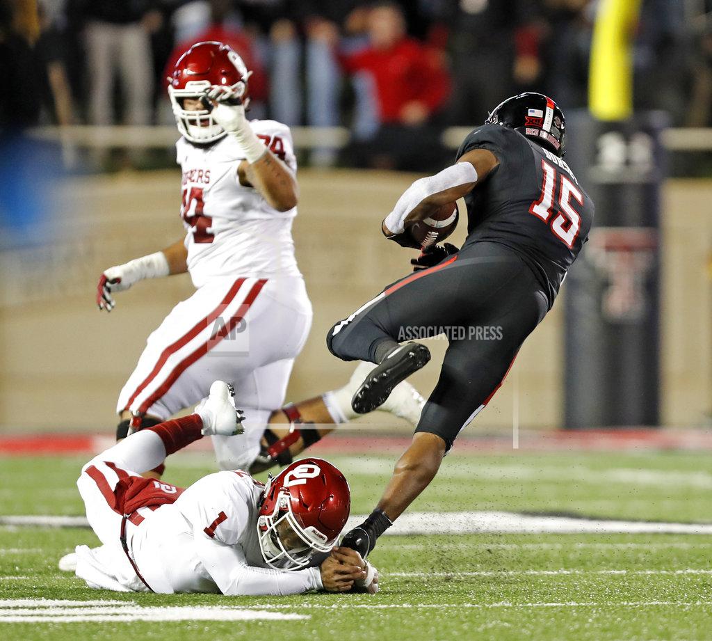 Brad Tollefson Texas Tech's Vaughnte Dorsey (15) breaks a tackle by Kyler Murray (1) after intercepting his pass during the first half of an NCAA college football game Saturday, Nov. 3, 2018, in Lubbock, Texas. (AP Photo/Brad Tollefson)