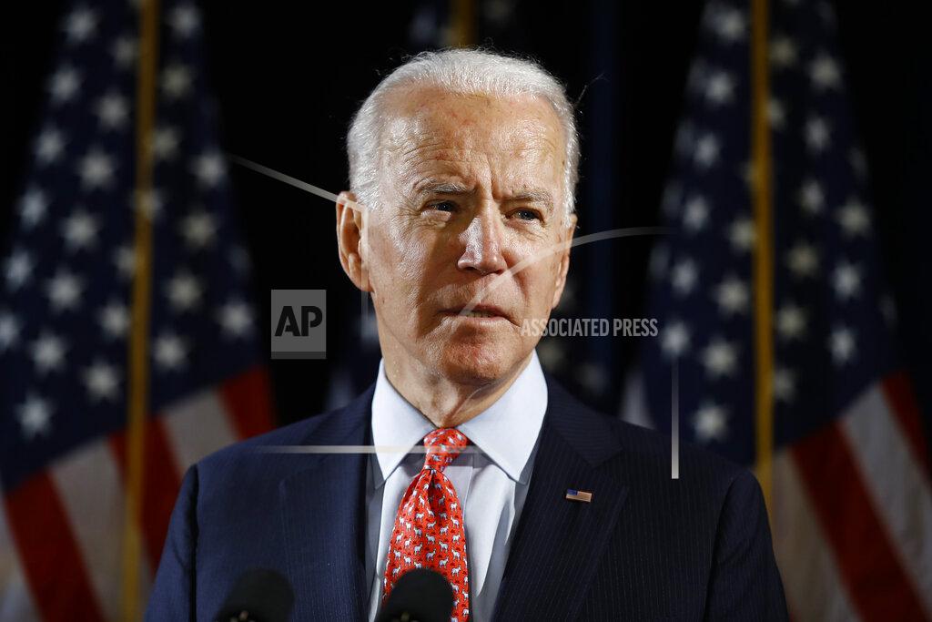 FILE - In this March 12, 2020, file photo Democratic presidential candidate former Vice President Joe Biden speaks about the coronavirus in Wilmington, Del. With the launch of his live-streamed web videos, weekly podcast and a new email newsletter, Joe Biden is building an online media presence since the coronavirus outbreak essentially froze traditional campaigning. (AP Photo/Matt Rourke, File)