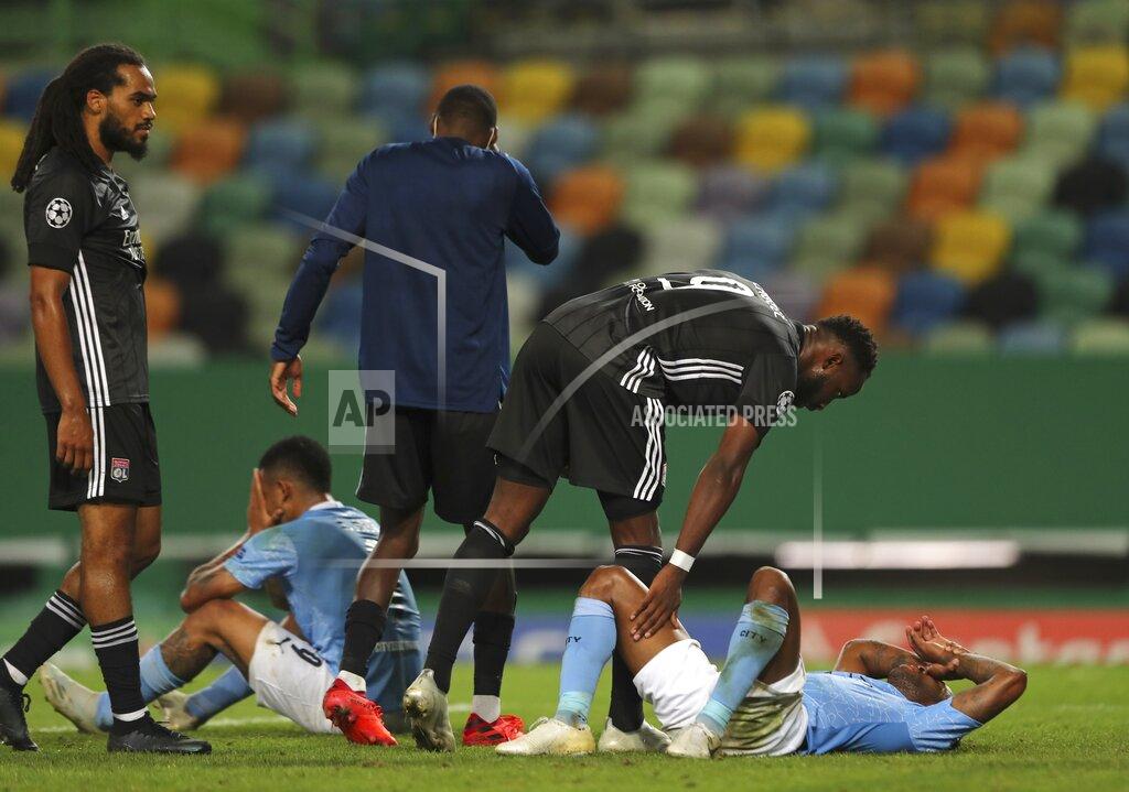 Miguel A. Lopes Manchester City's Gabriel Jesus, left, and Manchester City's Raheem Sterling react at the end of the Champions League quarterfinal soccer match between Lyon and Manchester City at the Jose Alvalade stadium in Lisbon, Portugal, Saturday, Aug. 15, 2020. Lyon won the match 3-1. (Miguel A. Lopes/Pool via AP)