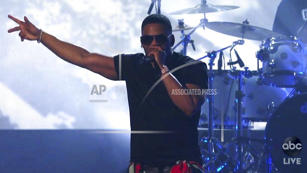 Uncredited In this screen shot provided by ABC on Sunday, Nov. 22, 2020, Nelly performs a medley at the American Music Awards at the Microsoft Theater in Los Angeles. (ABC via AP)