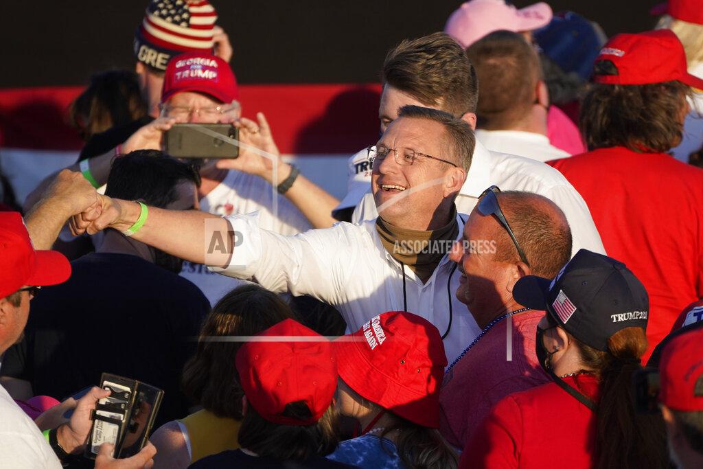 John Bazemore Republican senatorial candidate Rep. Doug Collins, R-Ga., works the crowd during a campaign rally for President Donald Trump at Middle Georgia Regional Airport, Friday, Oct. 16, 2020, in Macon, Ga. (AP Photo/John Bazemore)