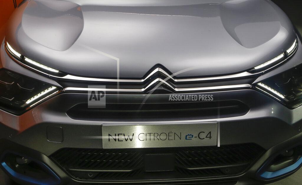 Michel Euler The Citroen e-C4 all electric hatchback is display during a media presentation in Paris, Tuesday, June 30, 2020. PSA Group's Citroen Brand is showing off a new version of its C4 compact hatchback, a model that will be key to the company's sales prospects as it faces a highly competitive European car market that faces severe headwinds from the coronavirus. (AP Photo/Michel Euler)