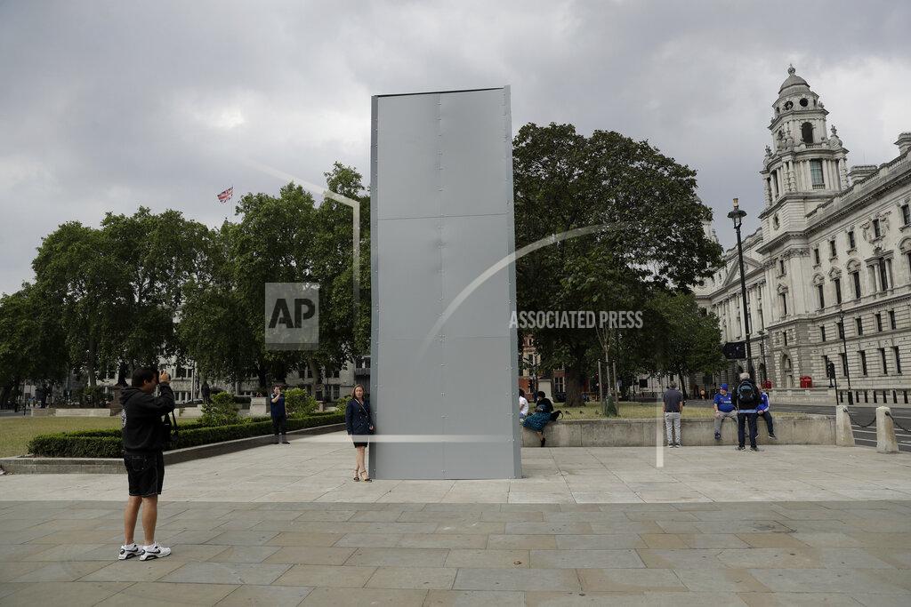 Matt Dunham A protective screen put up late Thursday encloses the statue of Britain's World War II Prime Minister Winston Churchill ahead of expected rival demonstrations by anti-racism and far-right protesters in London, Friday, June 12, 2020. Last Sunday the statue was daubed with the words "was a racist" during a protest against racism and police violence after the May 25 death of George Floyd, a black man who died after a white Minneapolis US police officer pressed a knee to his neck. (AP Photo/Matt Dunham)