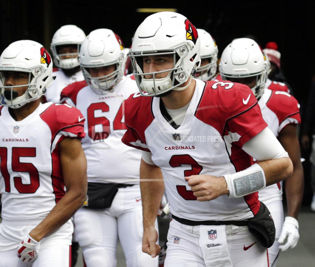 John Froschauer FILE - In this Dec. 30, 2018, file photo, Arizona Cardinals quarterback Josh Rosen (3) leads his team onto the field to warm-up before an NFL football game against the Seattle Seahawks, in Seattle. Rosen has been involved in trade rumors all offseason. It hasn't stopped him from joining his teammates for voluntary workouts this week. (AP Photo/John Froschauer, File)