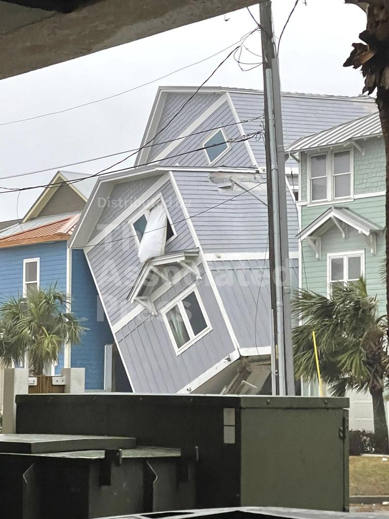 Sprawling storms wallop US with tornado reports, damage and heavy snow, closing roads and