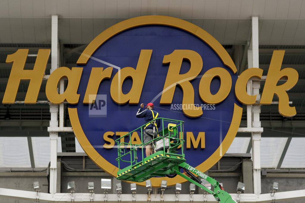 Chris Carlson A worker strings wire outside of the Hard Rock Stadium Monday, Jan. 27, 2020, in Miami Gardens, Fla. in preparation for the NFL Super Bowl 54 football game. (AP Photo/Chris Carlson)
