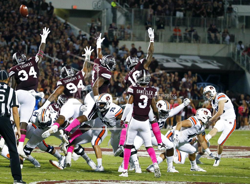Rogelio V. Solis Auburn place kicker Anders Carlson, right, kicks a 47-yard field goal against Mississippi State defenders during the first half of their NCAA college football game in Starkville, Miss., Saturday, Oct. 6 2018. (AP Photo/Rogelio V. Solis)
