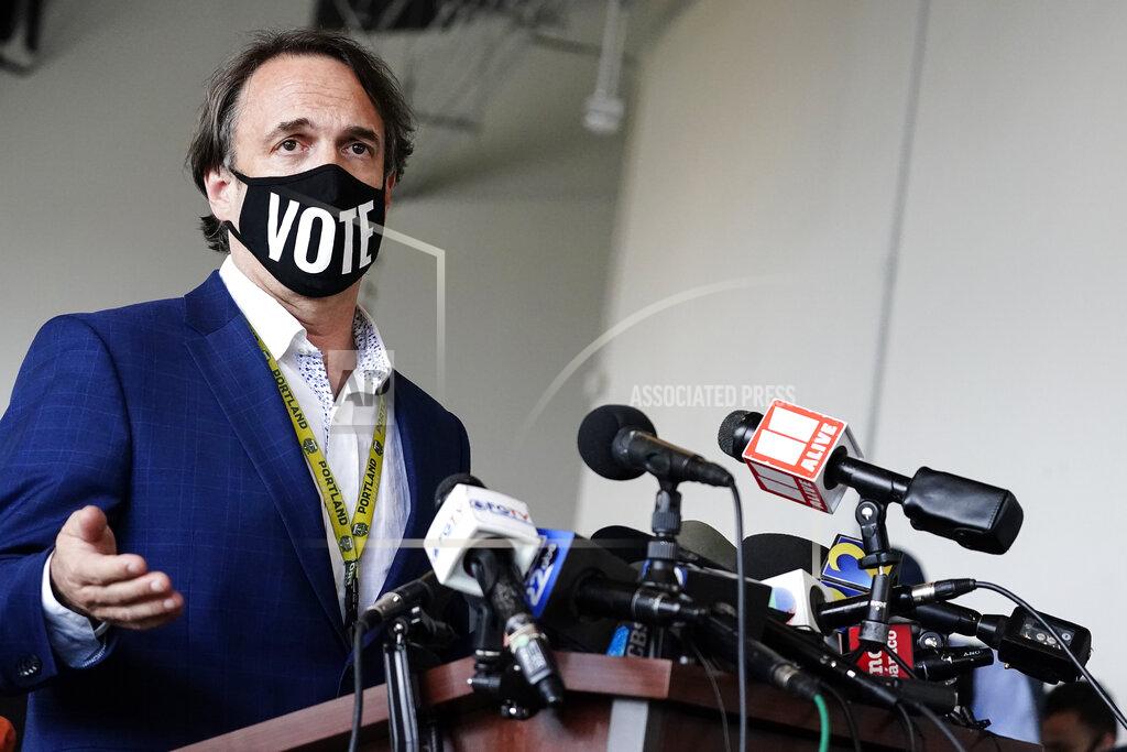 Fulton County Elections Director Richard Barron talks to the media about the ballot count for the general election at State Farm Arena on Thursday, Nov. 5, 2020, in Atlanta. (AP Photo/Brynn Anderson)