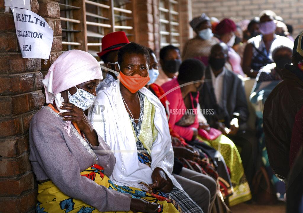 Thoko Chikondi People wait to receive the AstraZeneca COVID-19 vaccine at Ndirande Health Centre in Blantyre Malawi, Monday, March 29, 2021. Malawi is vaccinating health care workers, elderly and those with health conditions that put them at higher risk of severe COVID-19, using the AstraZeneca doses that arrived early in March. (AP Photo/Thoko Chikondi)